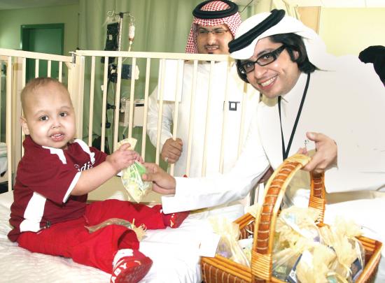 Nawaf Al-Egla DISTRIBUTING GIFTS FOR CHILDREN