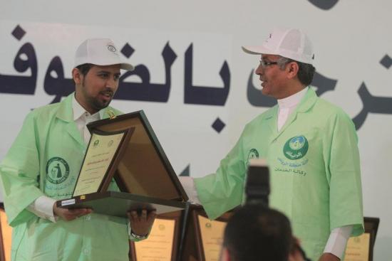Nawaf Al-Egla DISTRIBUTING GIFTS FOR CHILDREN